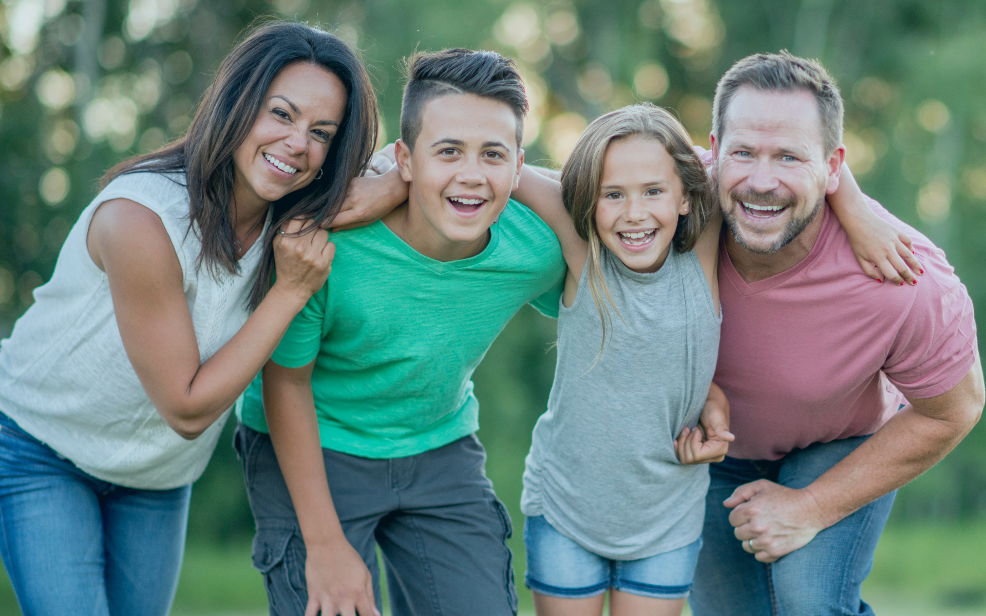 family-smiling-outside